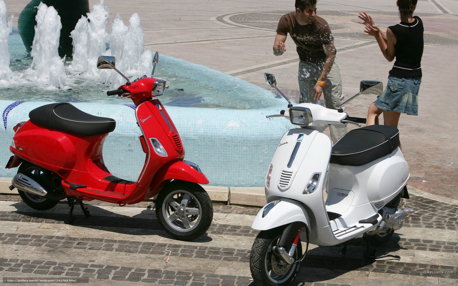 Scooters by a fountain
