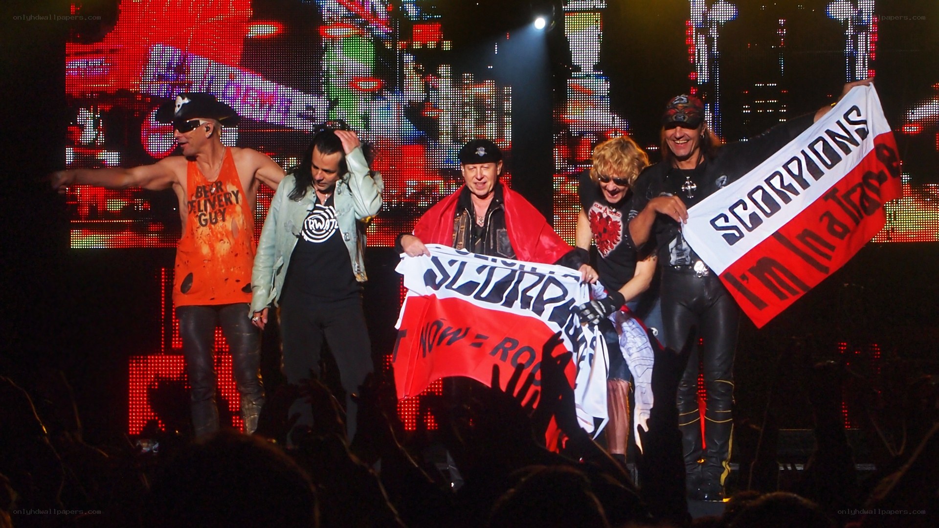 Scorpions on stage with fans