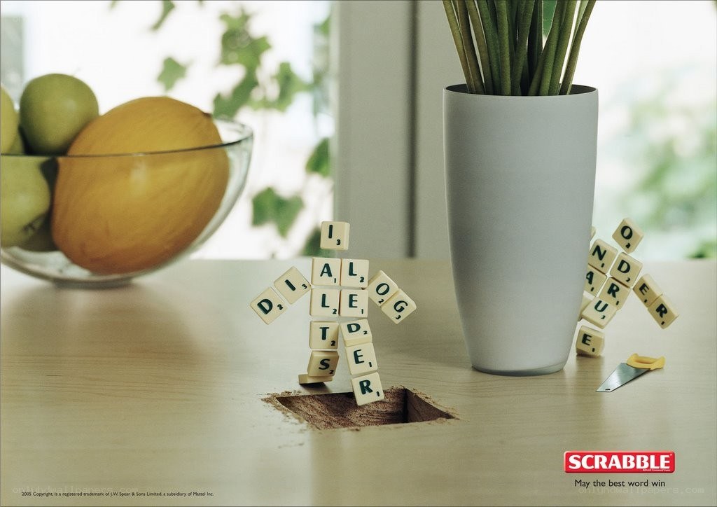 Scrabble tiles forming figures on a table