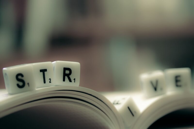 Scrabble Tiles on Book