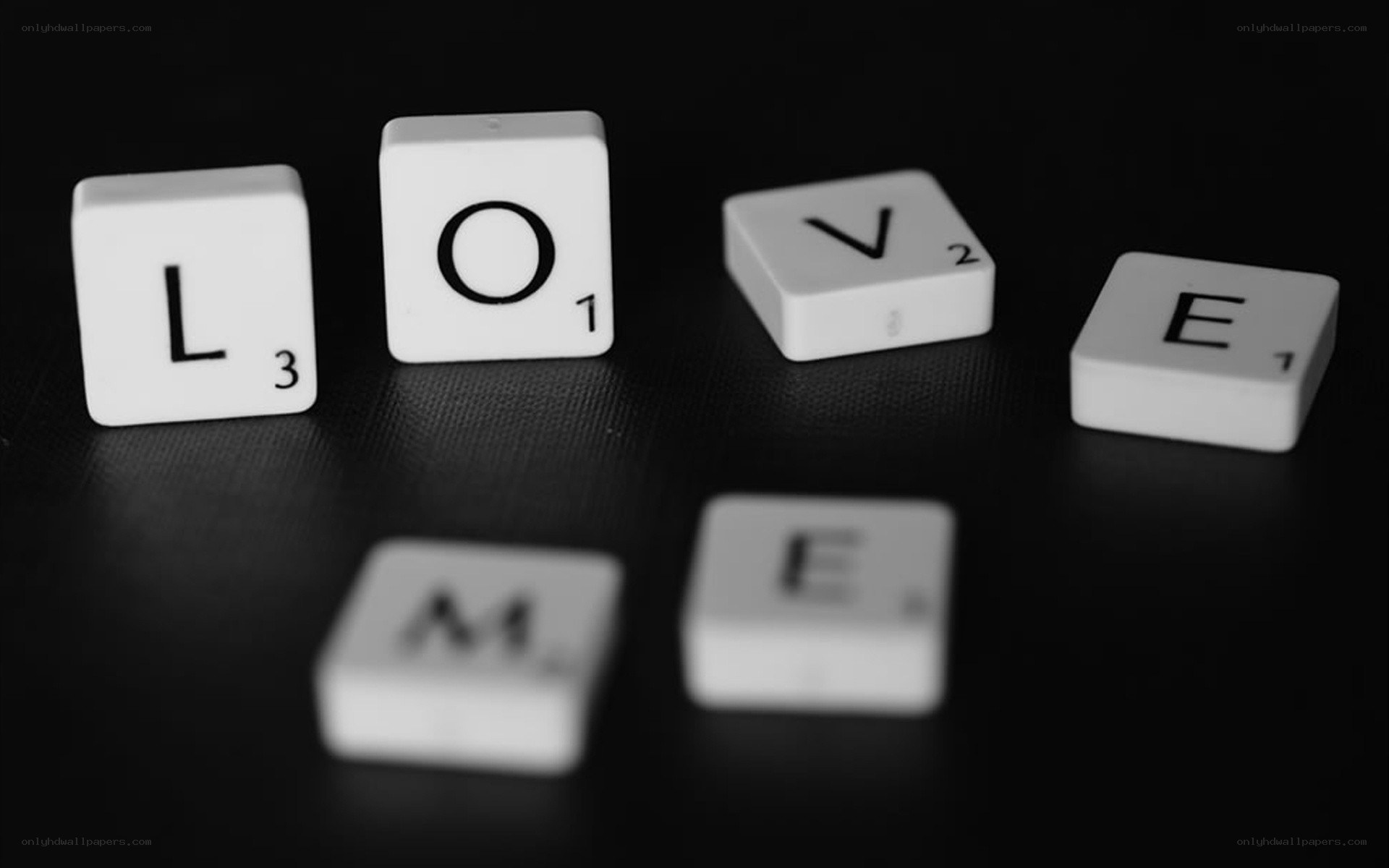 Scrabble tiles spelling LOVE
