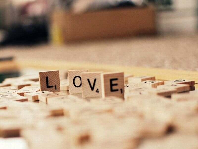 Scrabble Tiles Spelling Love — Brown