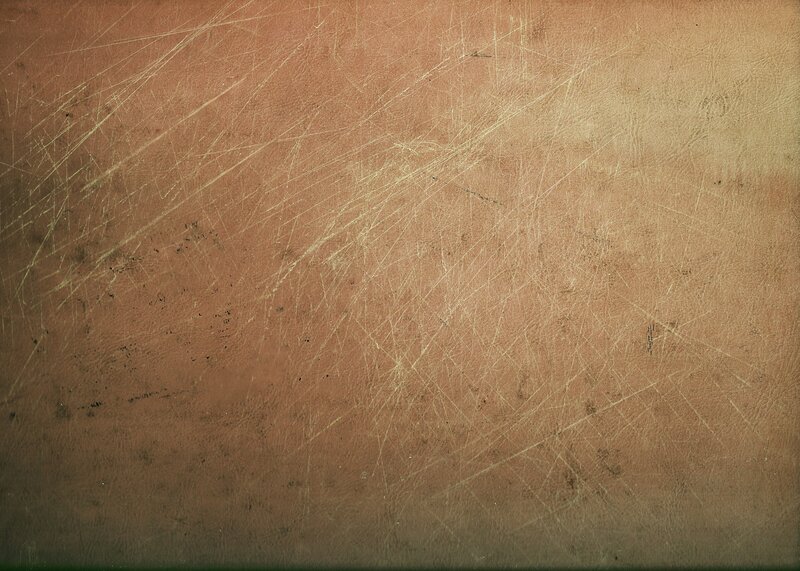scratched brown leather surface