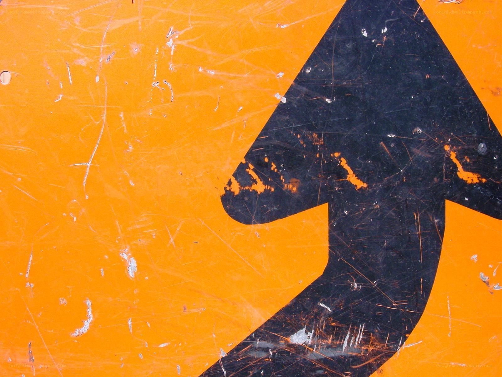 scratched orange road sign