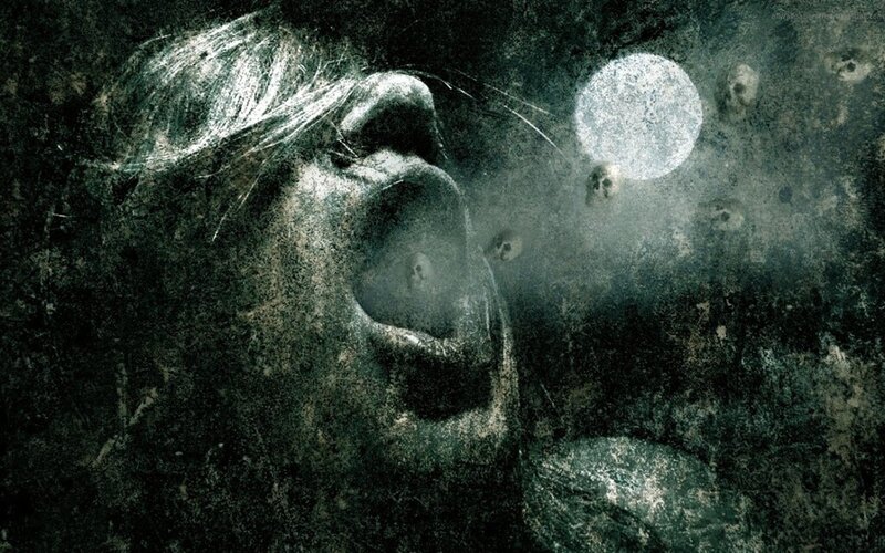 screaming face in dark scene