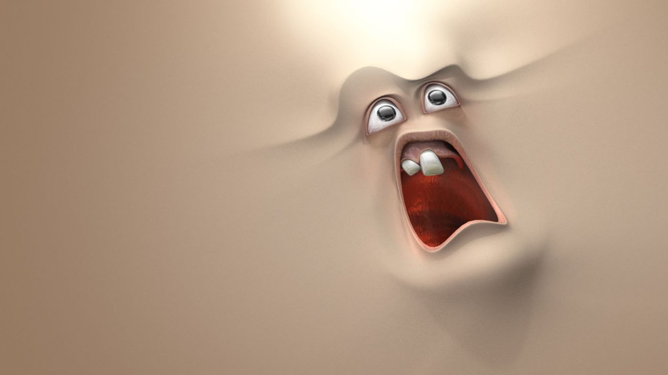 screaming face in sand
