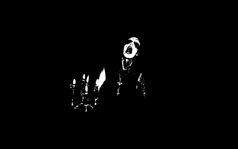 screaming figure in darkness