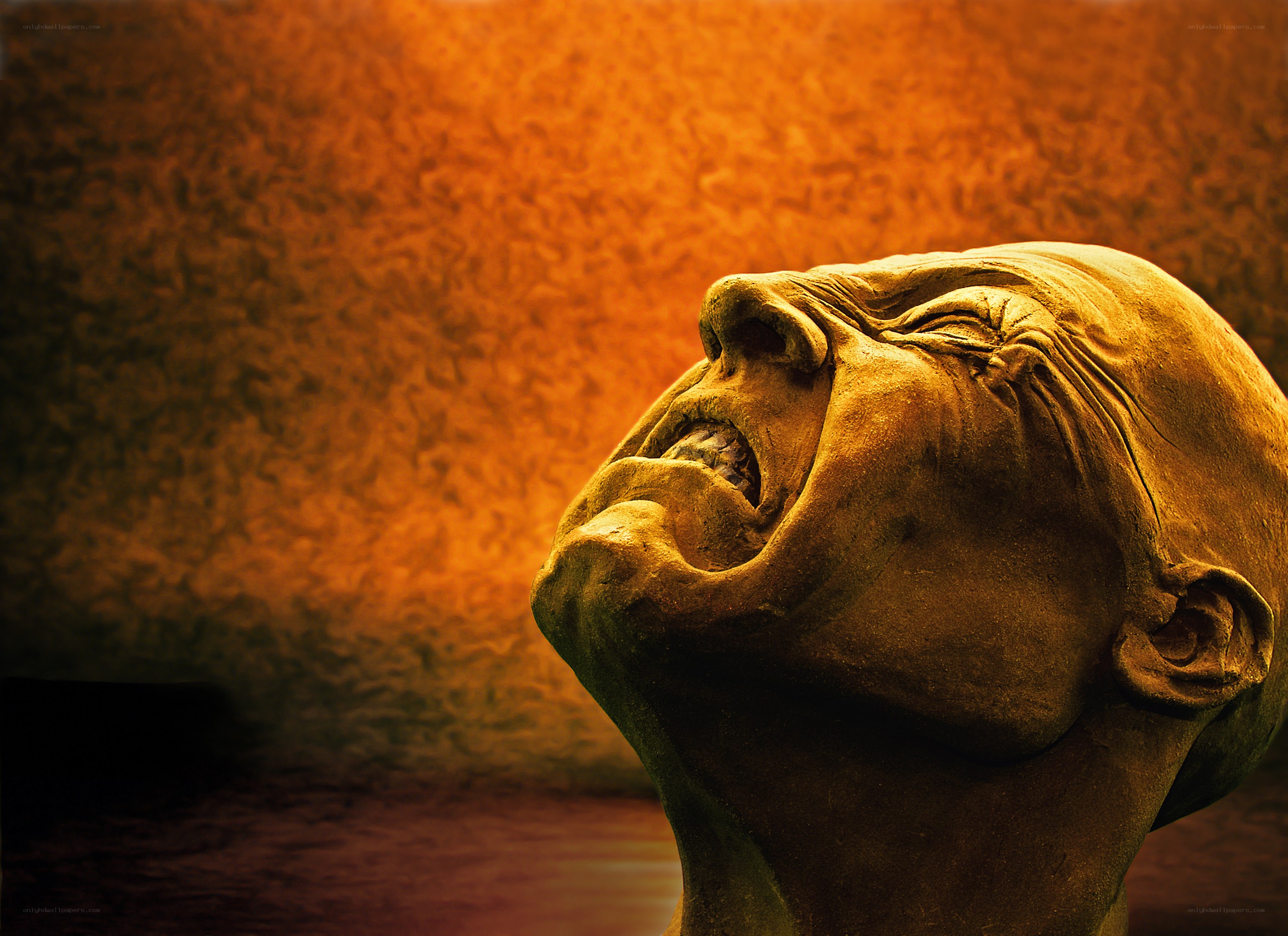 Screaming stone head sculpture