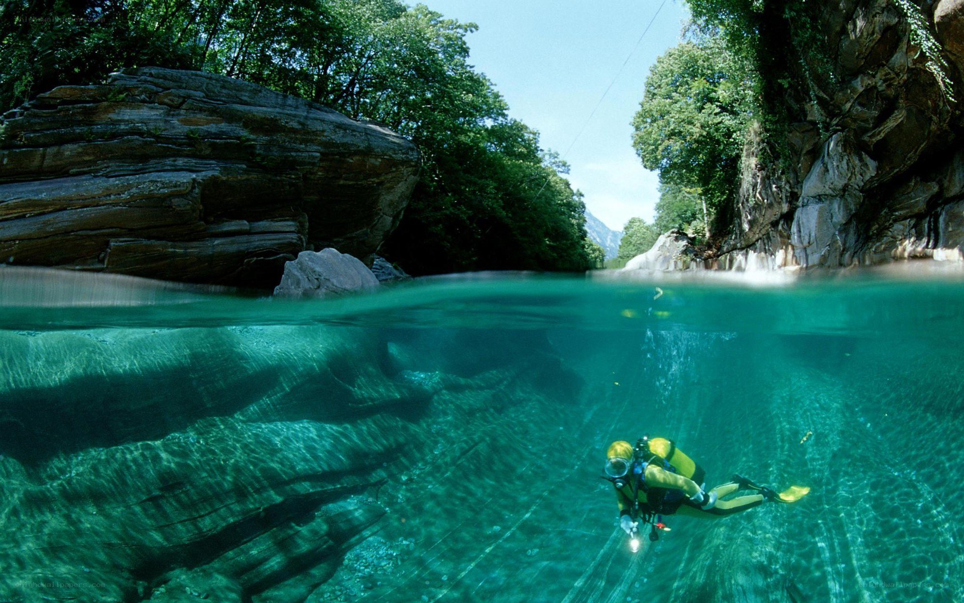 Scuba diver in a river canyon
