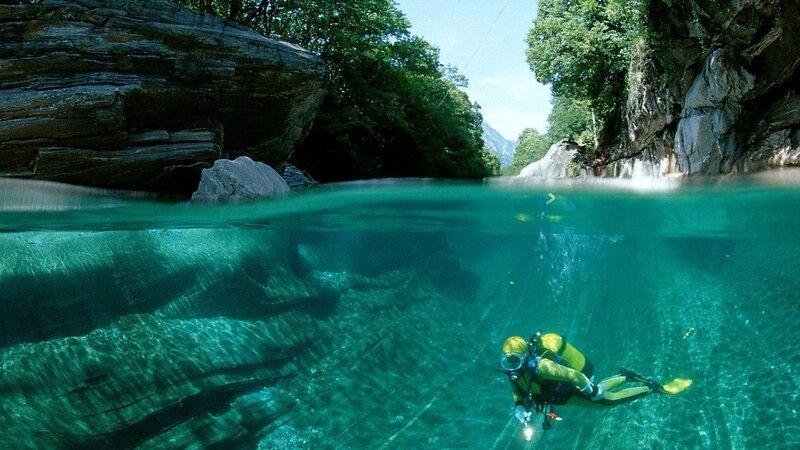 scuba diver in a river canyon