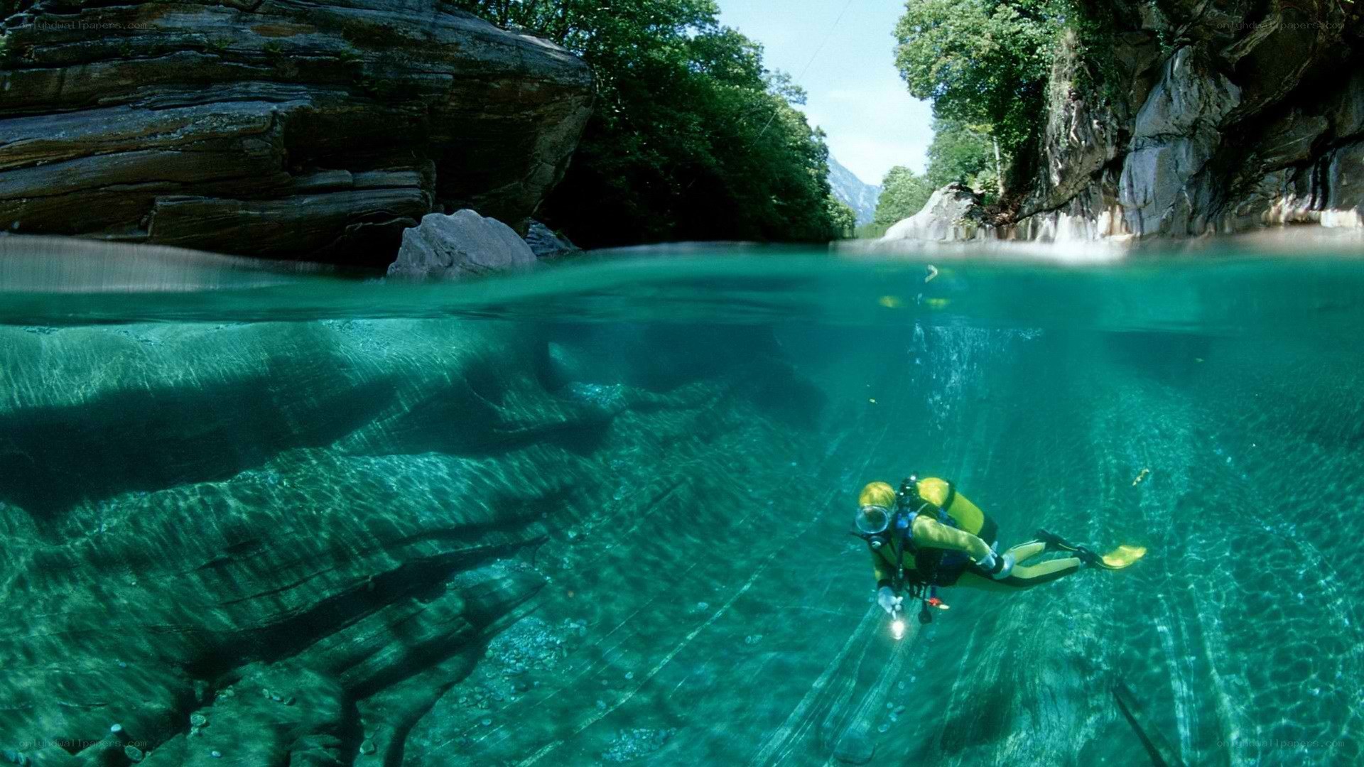 Scuba diver in clear river