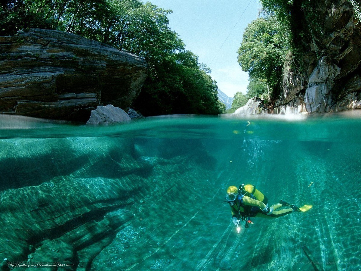 scuba diver in clear river