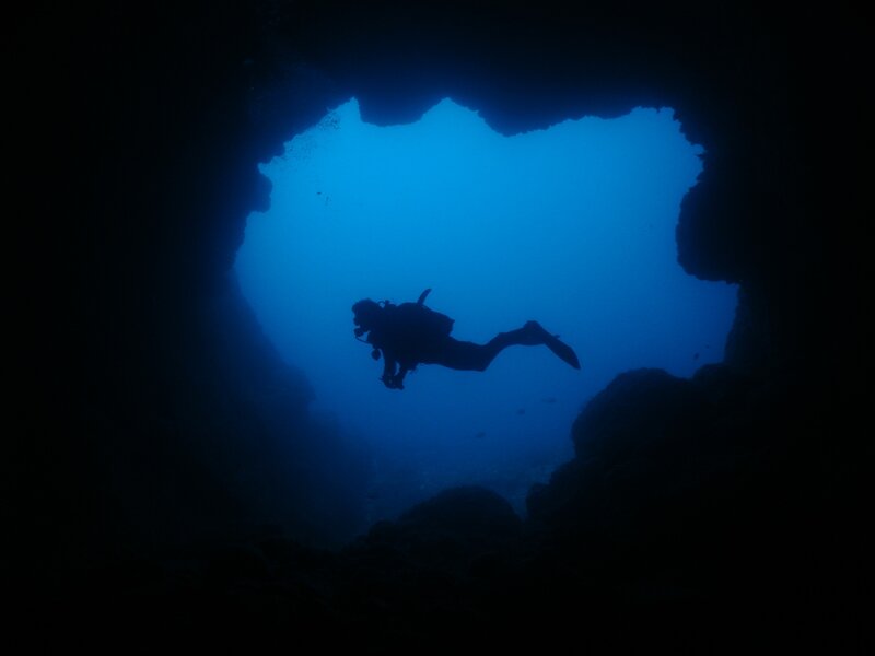 scuba diver in underwater cave