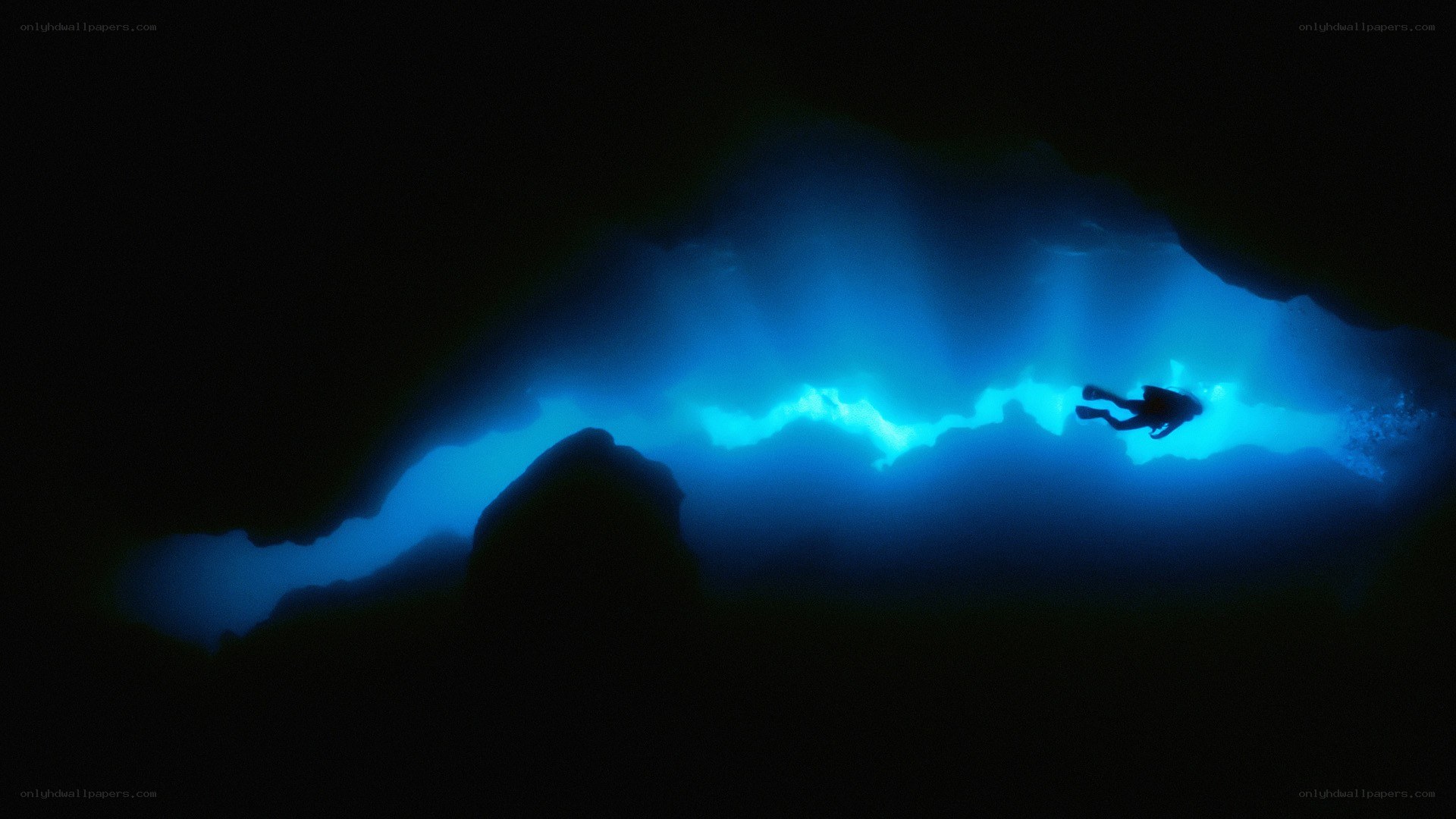 scuba diver in underwater cave