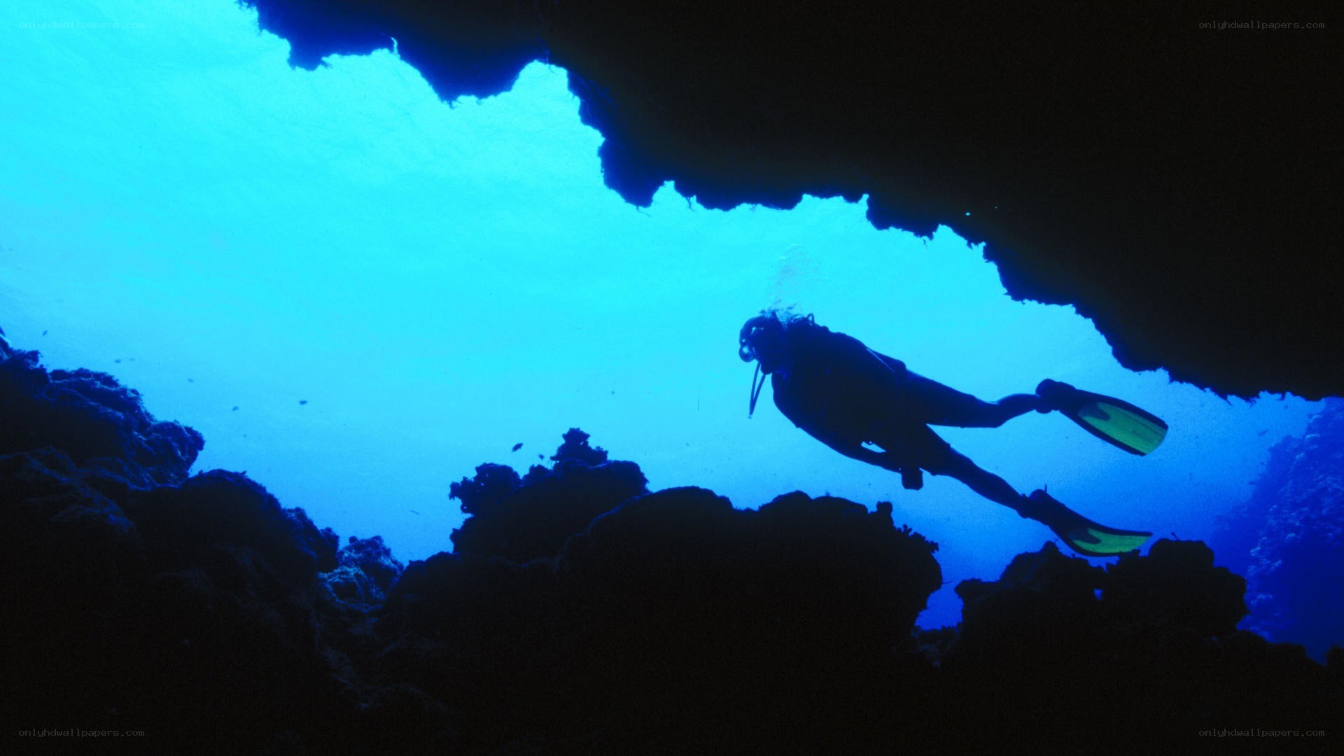 scuba diver in underwater cave