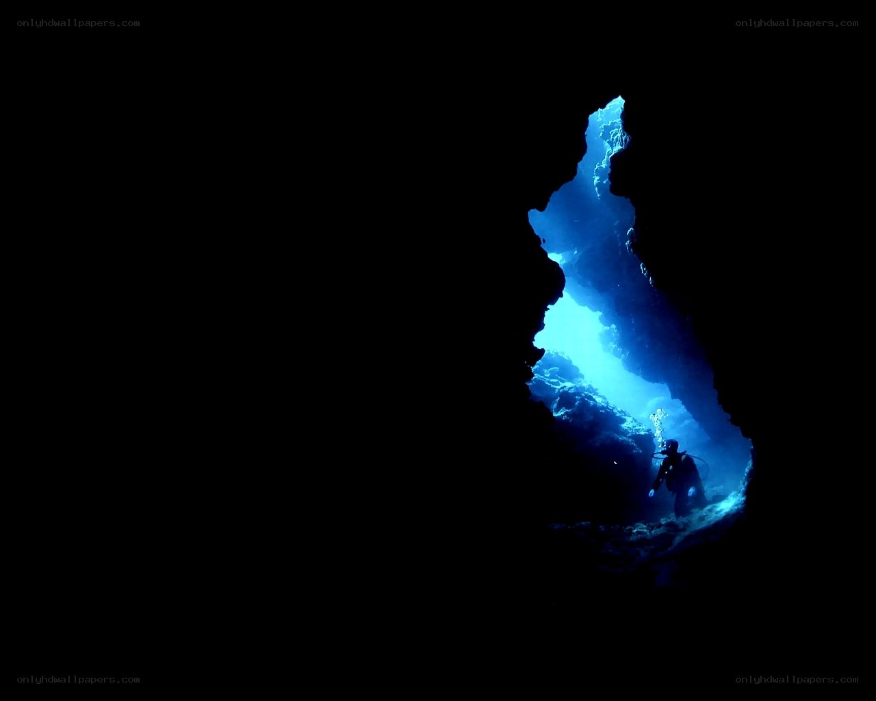 scuba diver in underwater cave