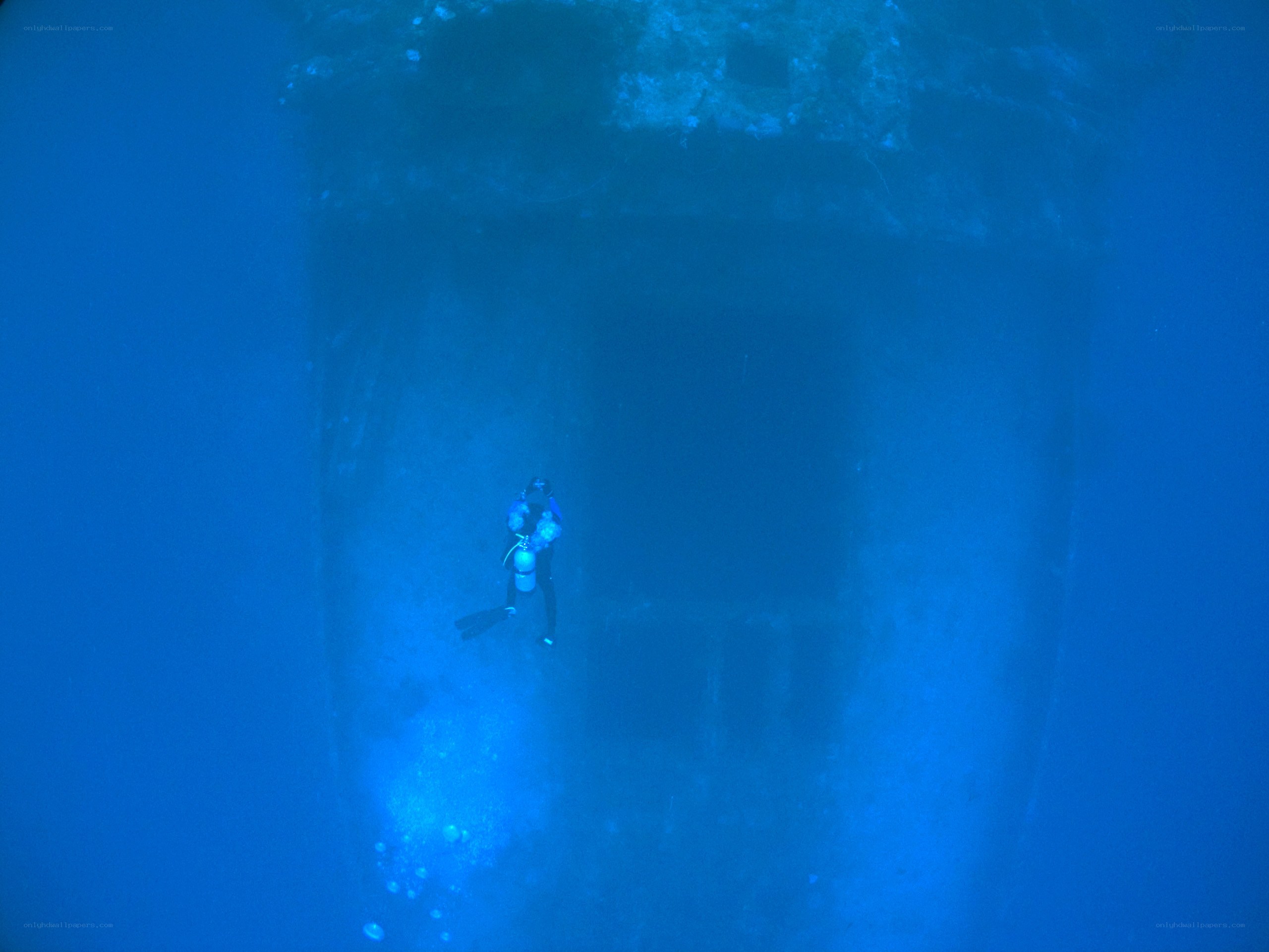 scuba diver near shipwreck