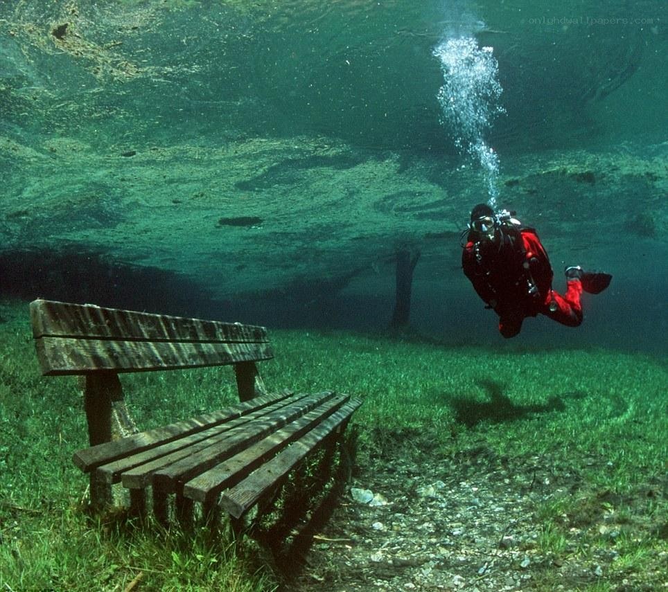Scuba diver near underwater bench