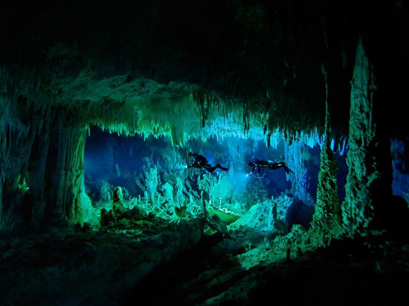Scuba Divers in Cave — Green