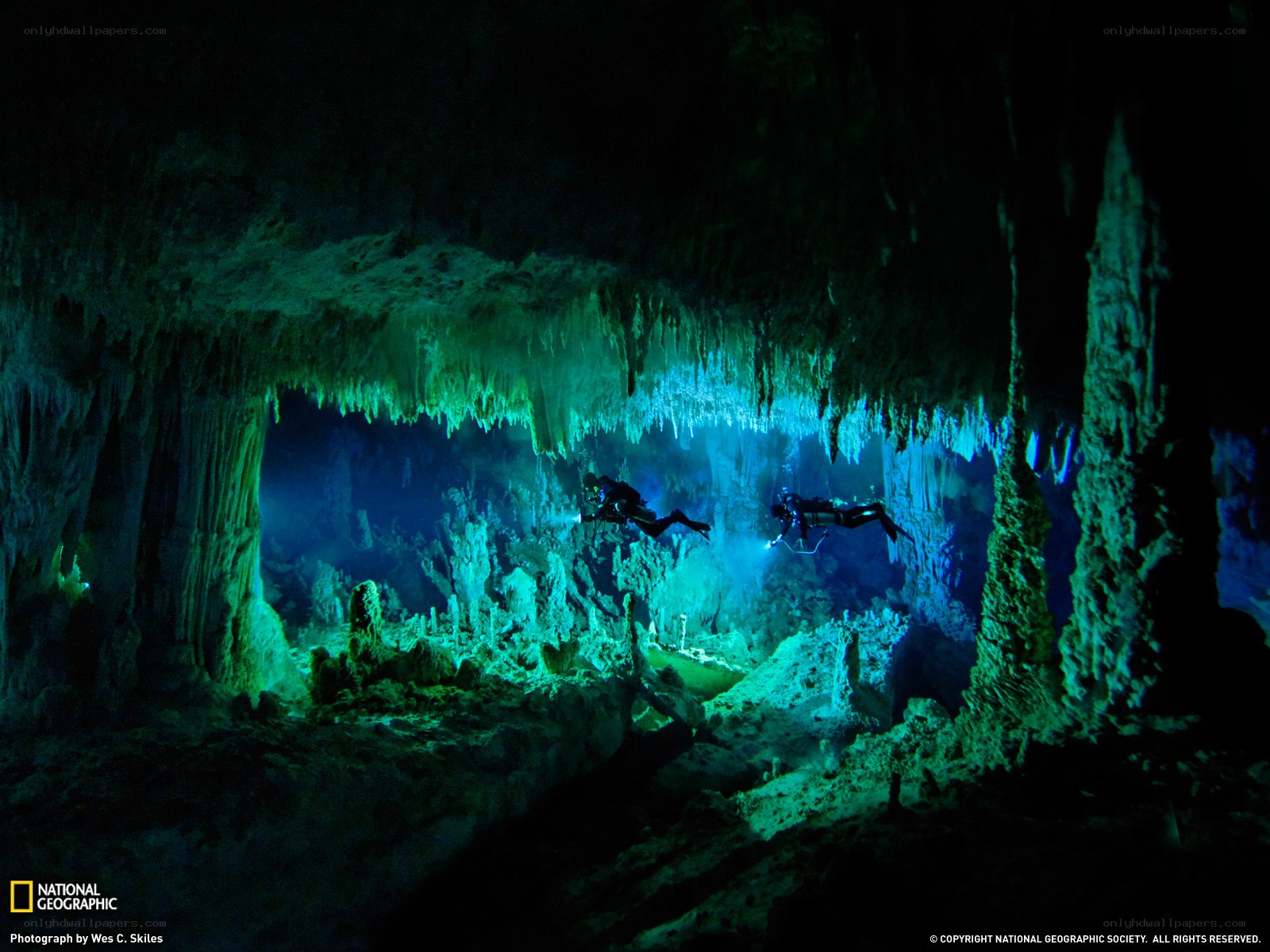 Scuba divers in underwater cave