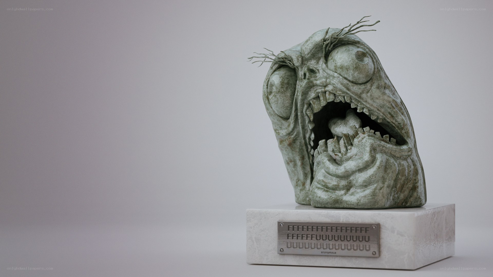 sculpted horror head on pedestal