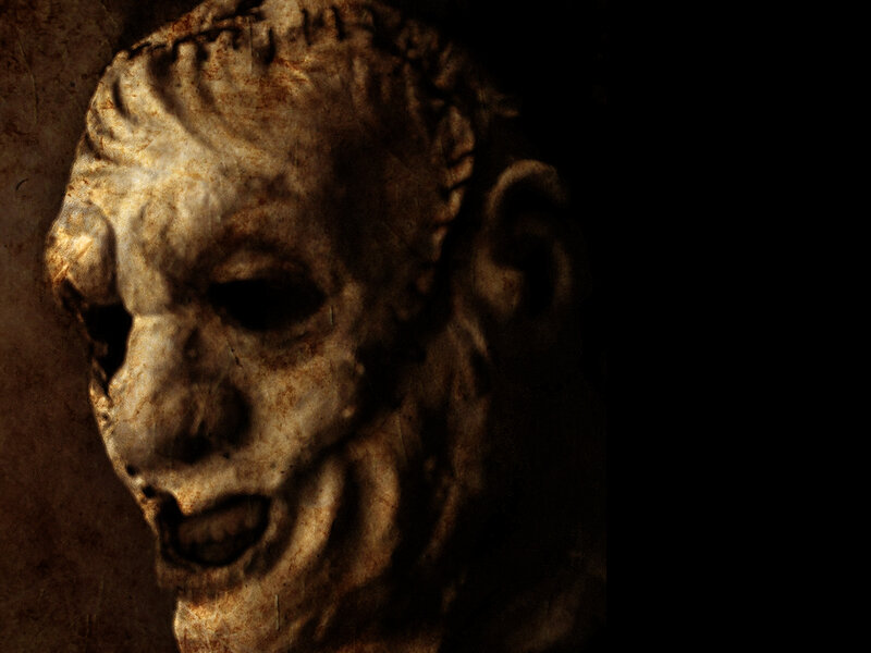 sculpted mask of a screaming face