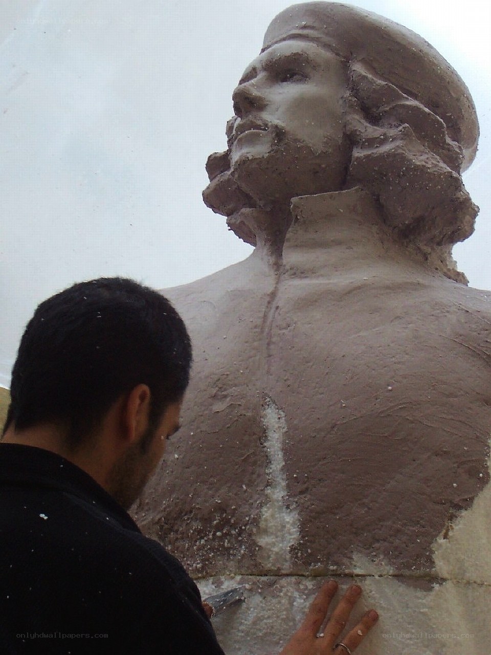 sculptor working on a bust