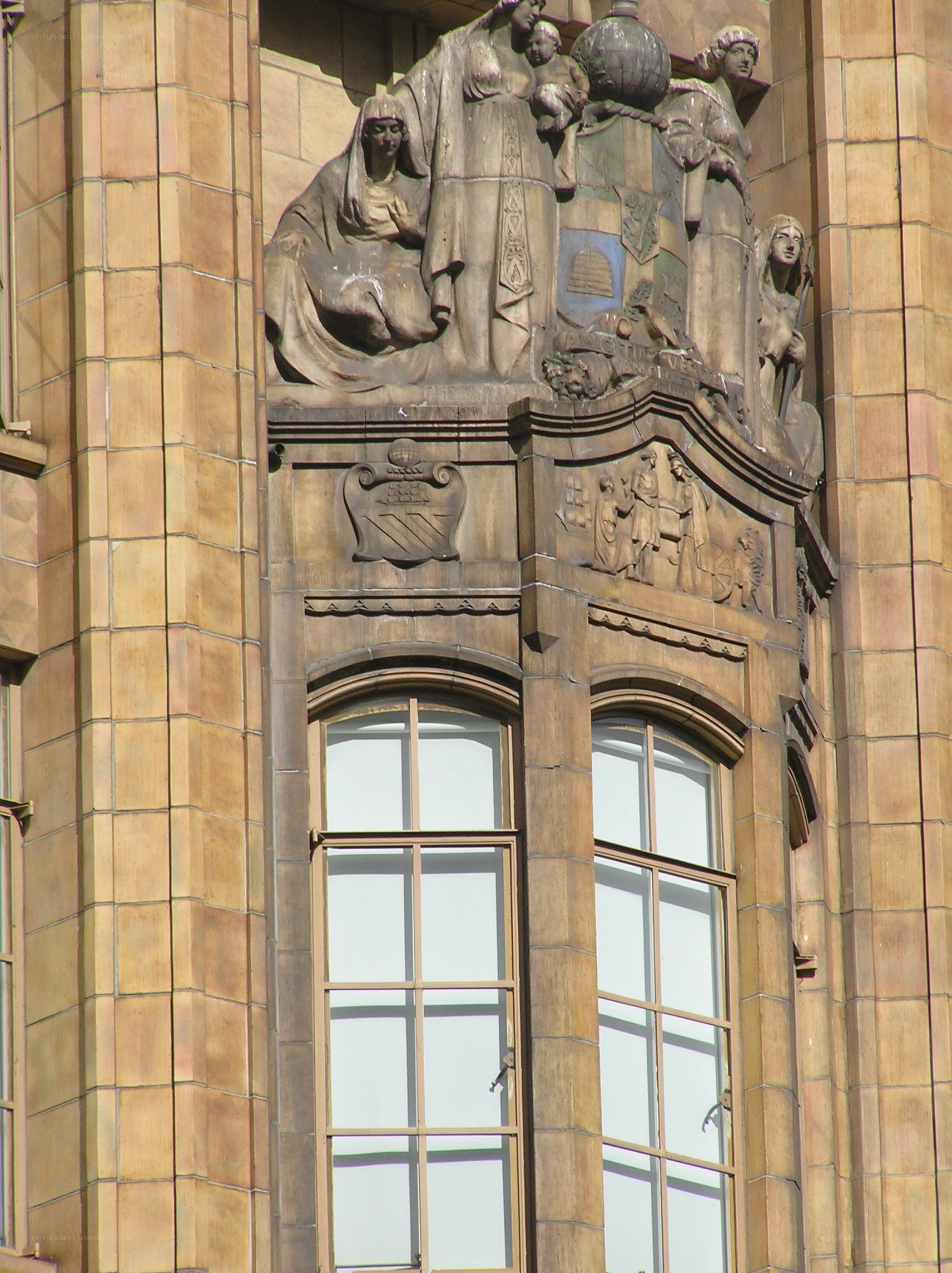 sculpture above building windows