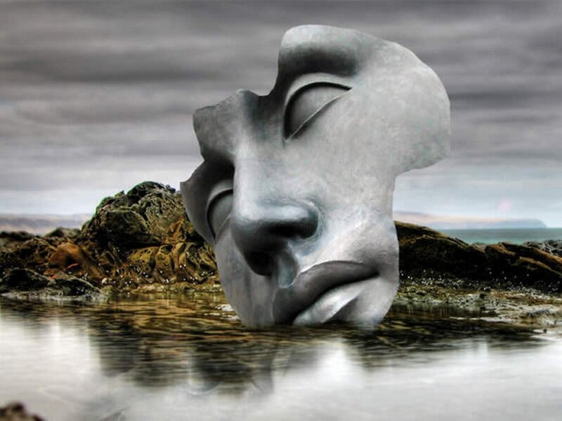Sculpture of a face in water