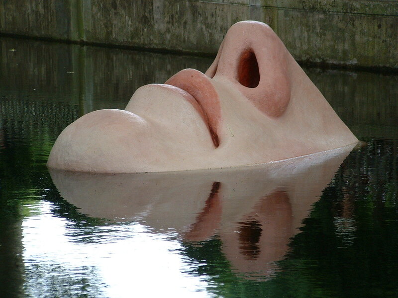 Sculpture of a face in water