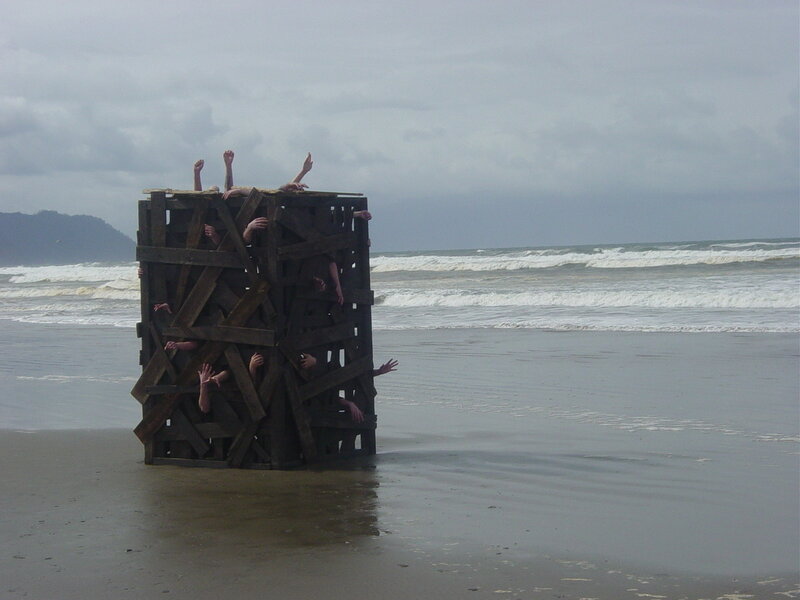 Sculpture of hands on beach