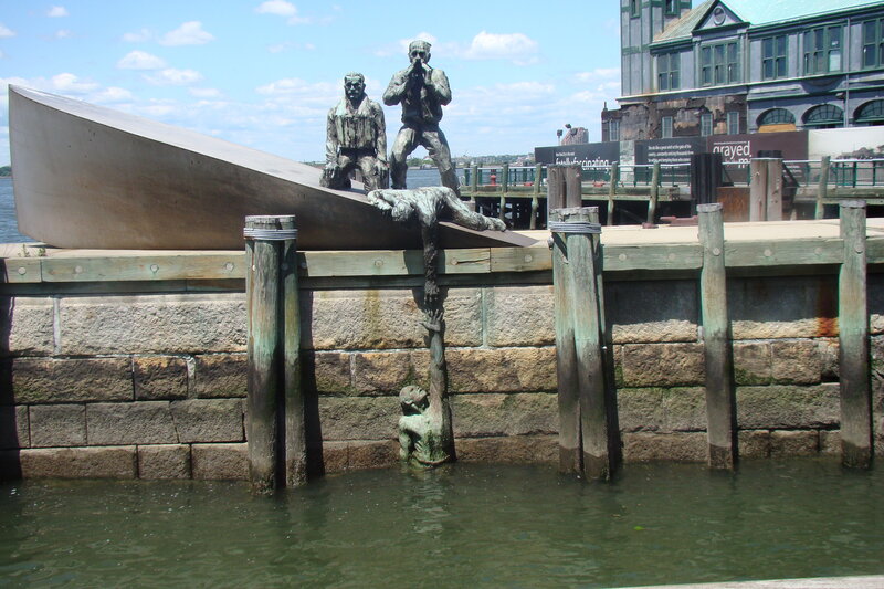 Sculpture of Men on Boat