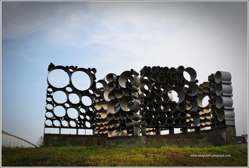 sculpture of pipes on hill