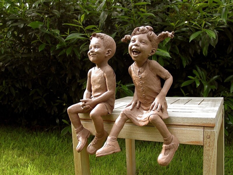 Sculpture of two children laughing