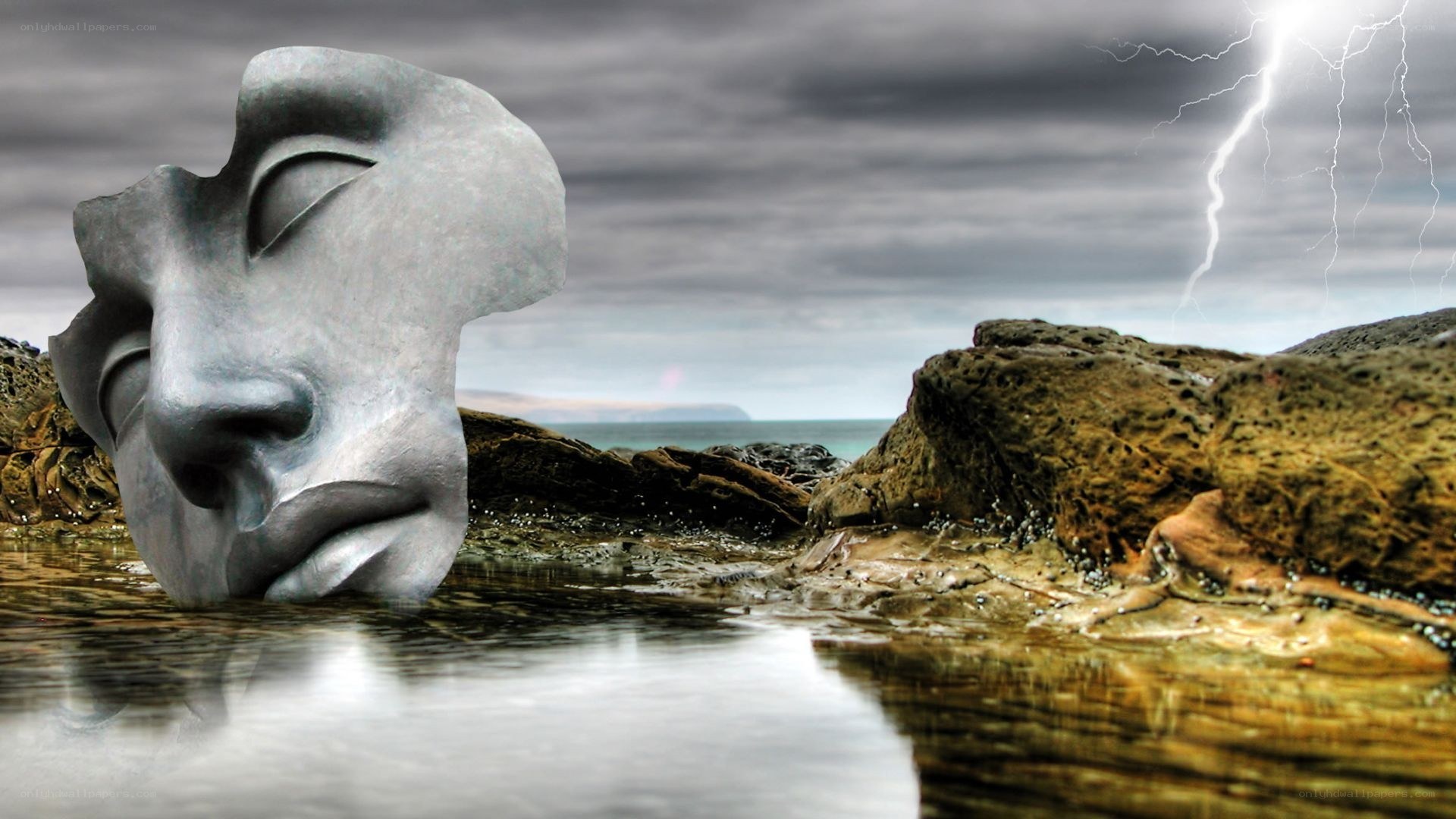 Sculpture on a stormy beach