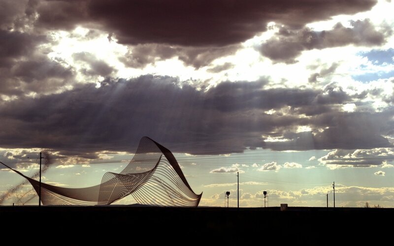 Sculpture under dramatic sky