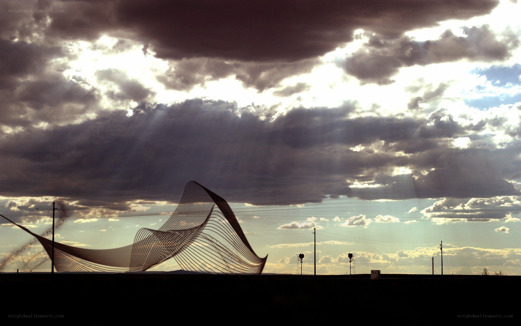 Sculpture under dramatic sky