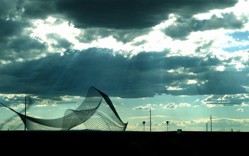 Sculpture under stormy sky