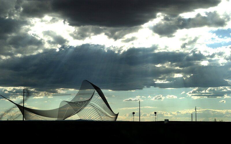 Sculpture under stormy sky
