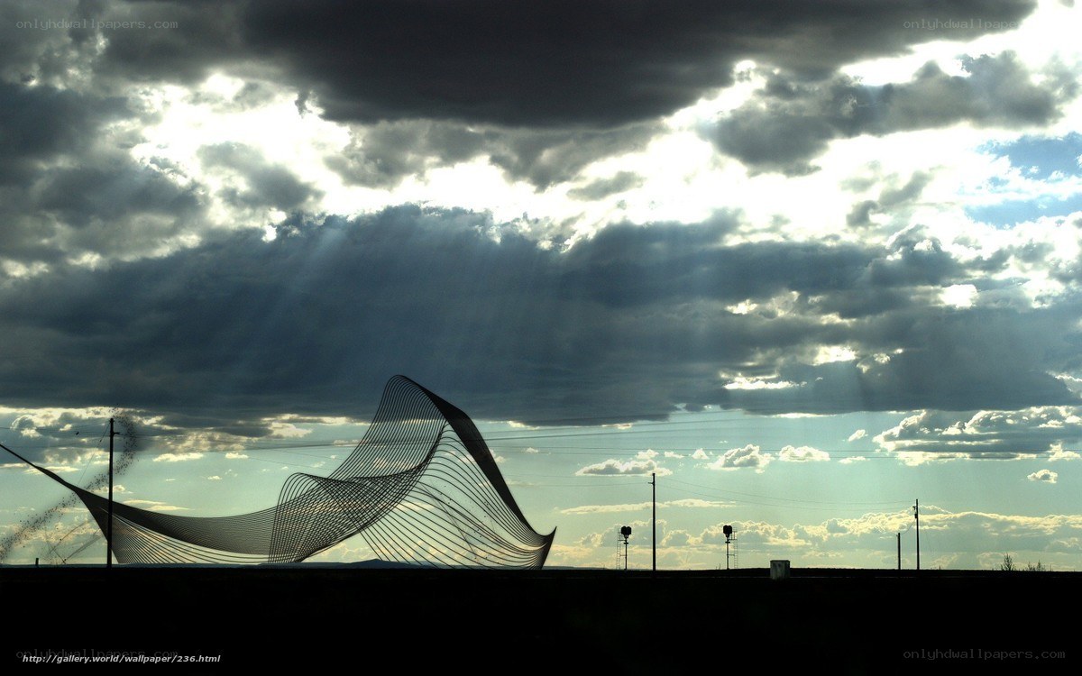 Sculpture under stormy sky