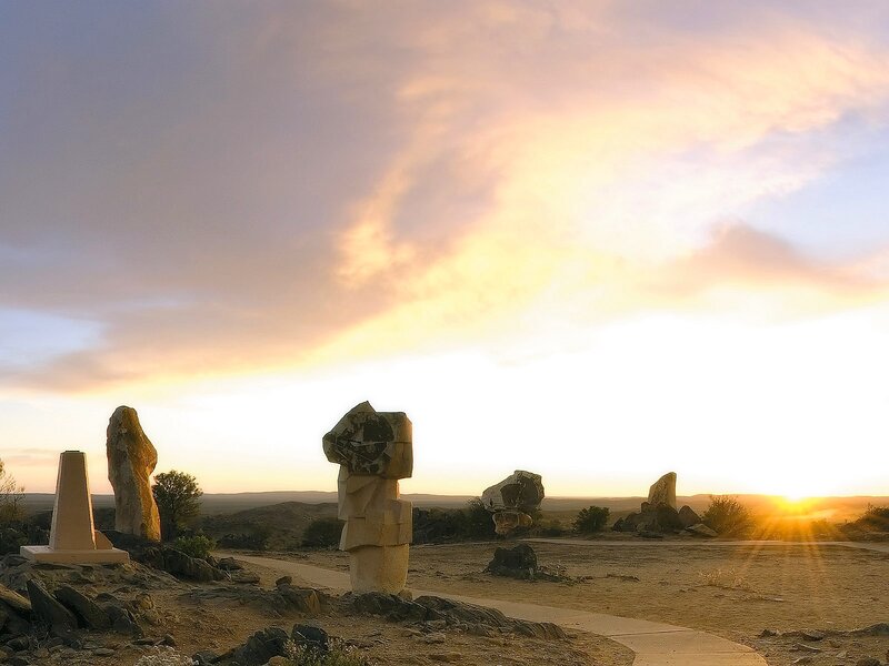 Sculptures at sunset in desert
