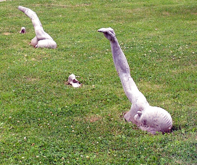 Sculptures in a grassy field