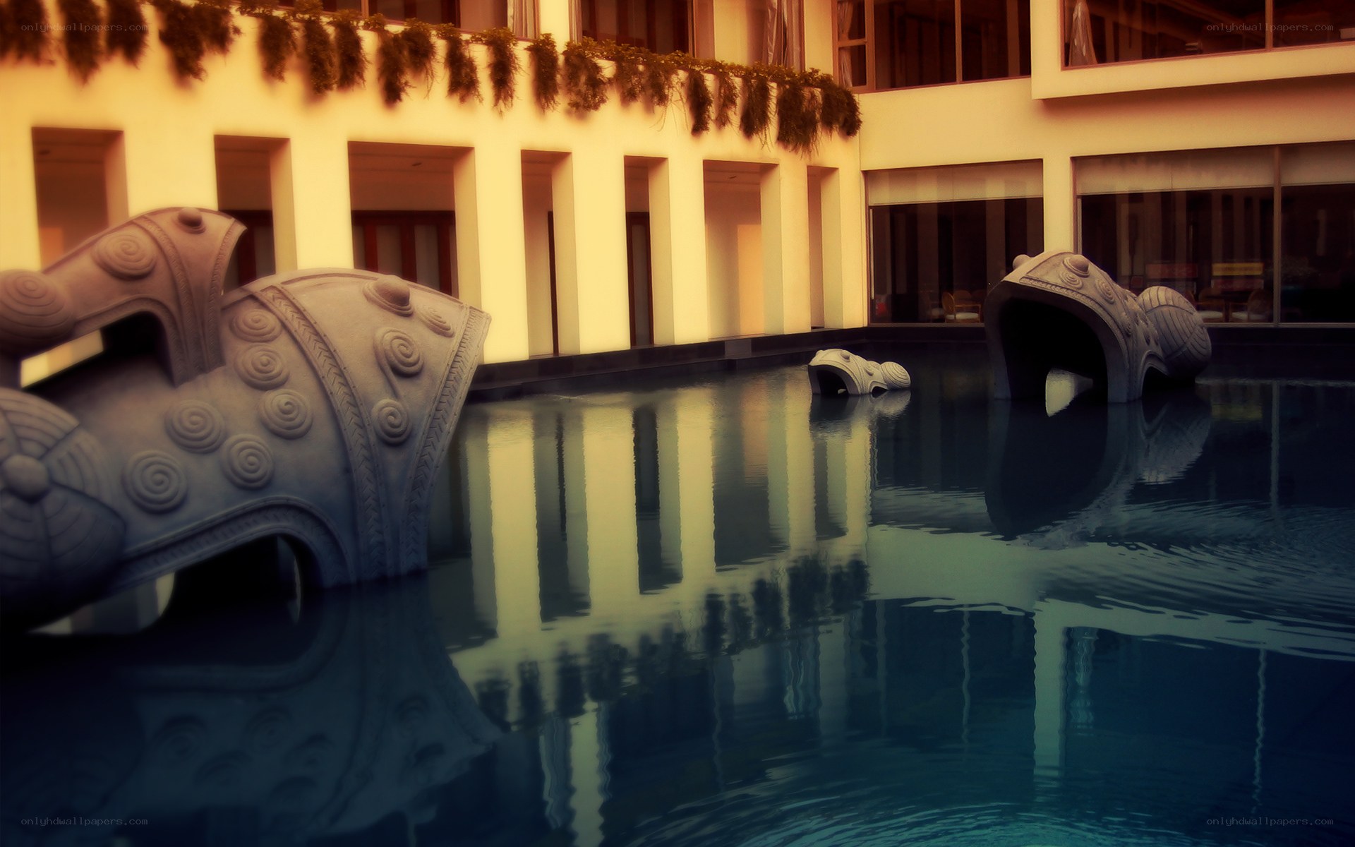sculptures in a pool courtyard