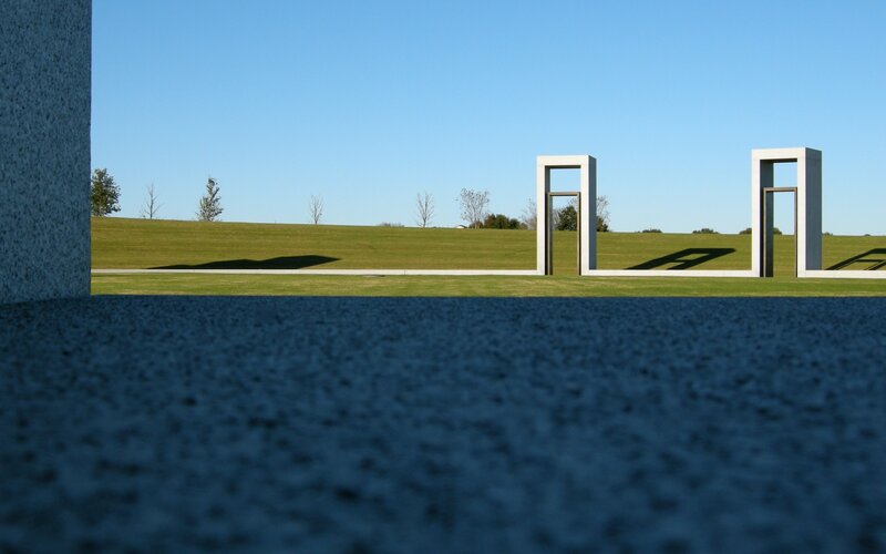 Sculptures on a grassy hill
