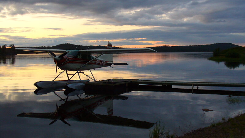 Seaplane at sunset on lake
