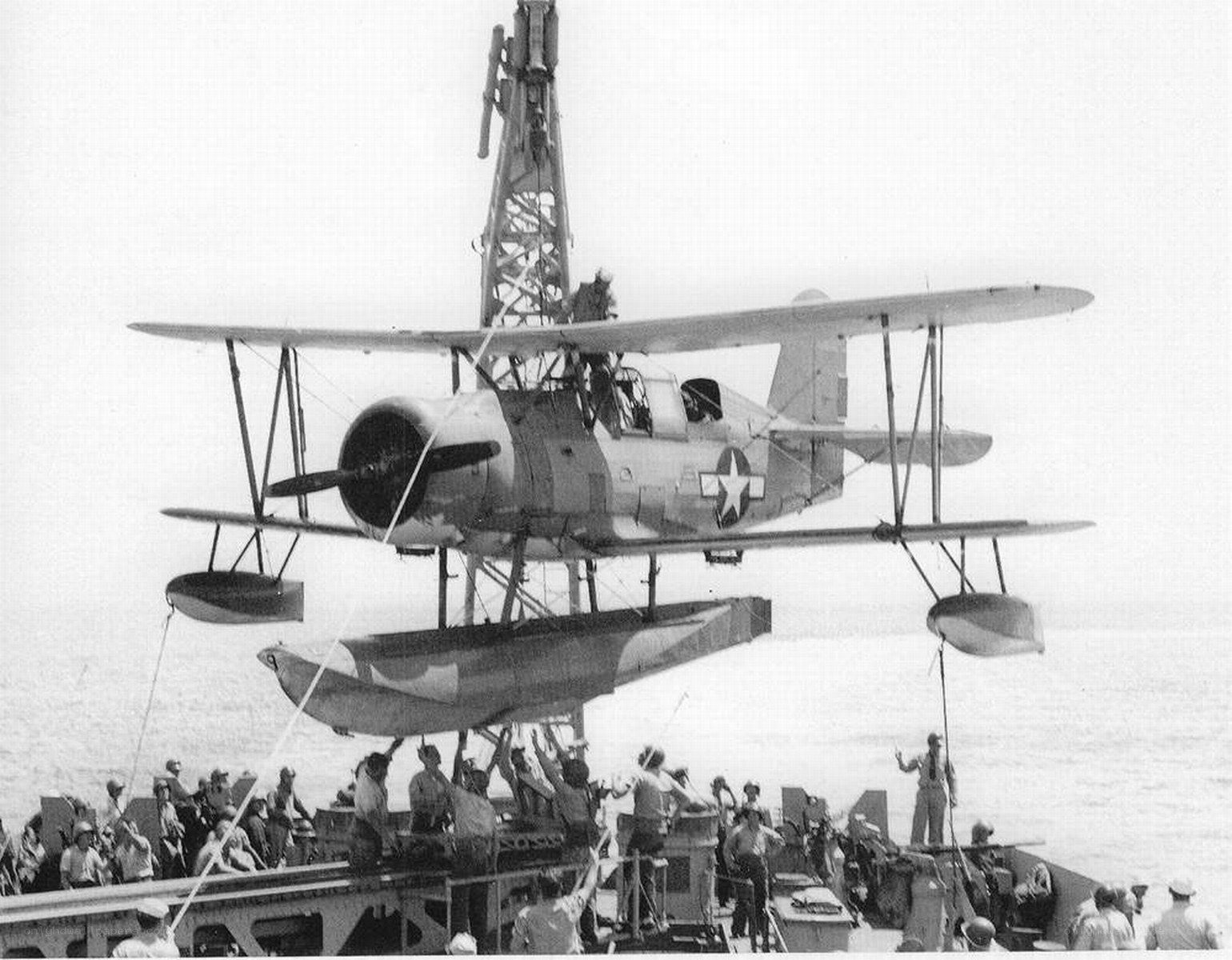 Seaplane being lifted from ship