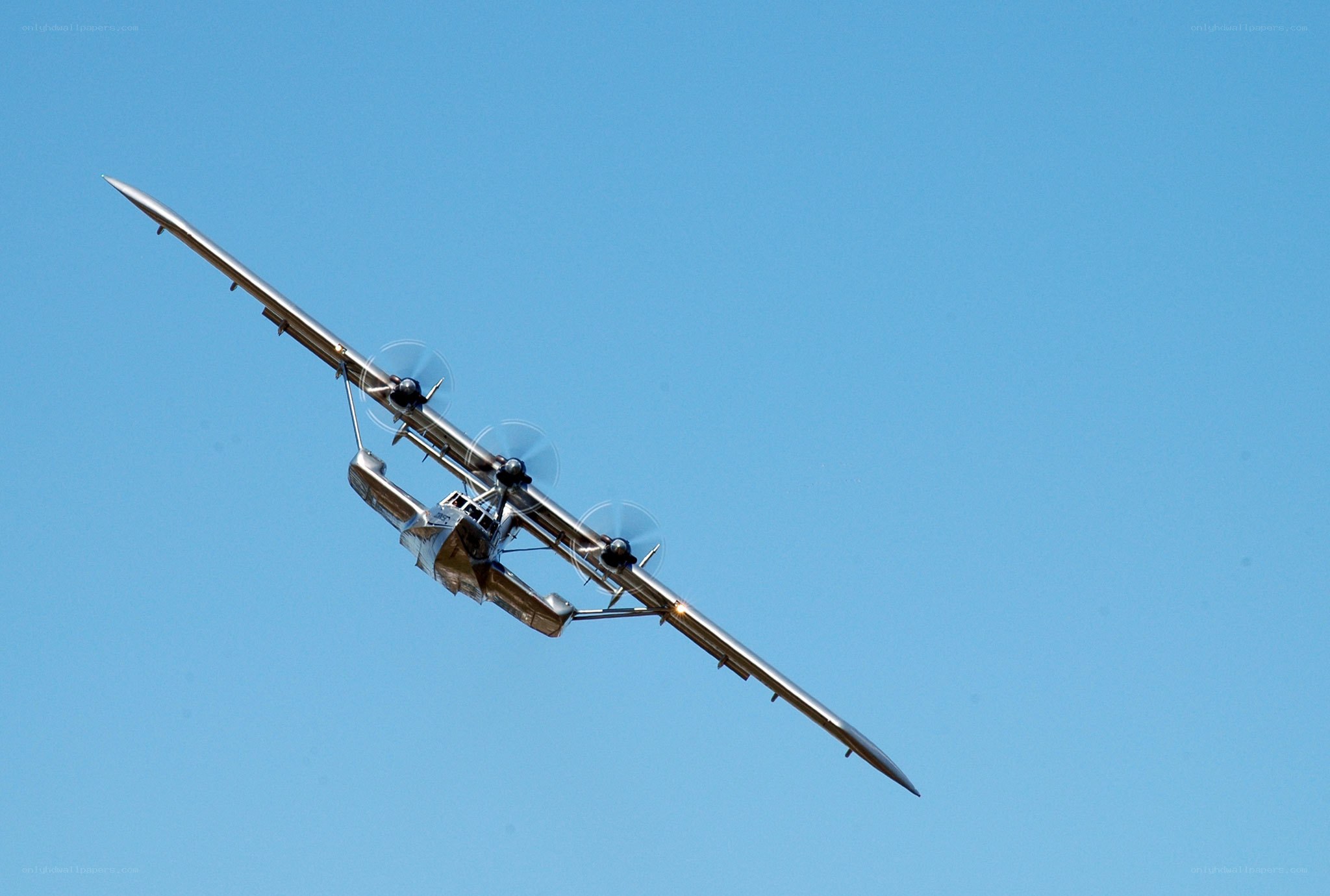 seaplane flying in blue sky