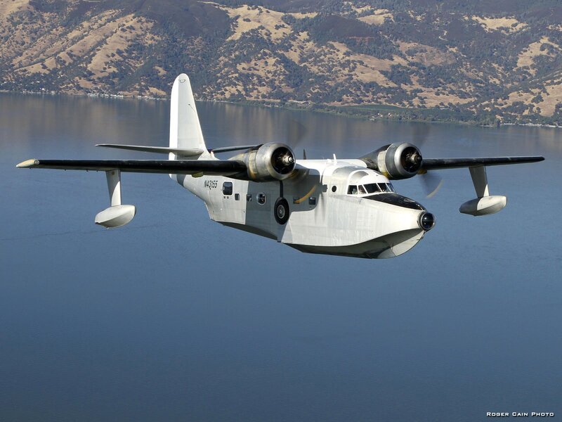 Seaplane Flying over Lake — Blue