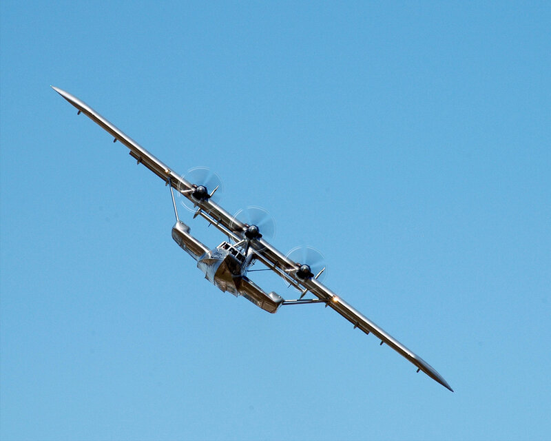 Seaplane in flight against blue sky