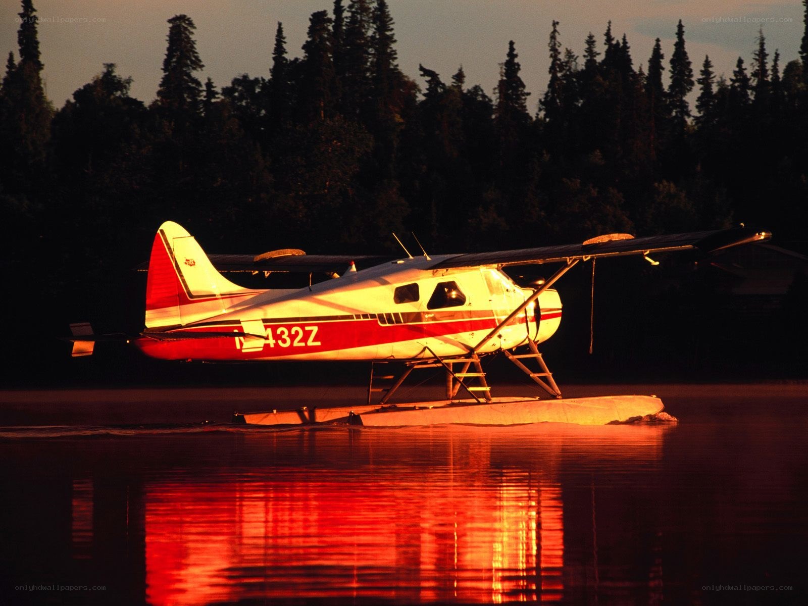 Seaplane on a lake at sunset